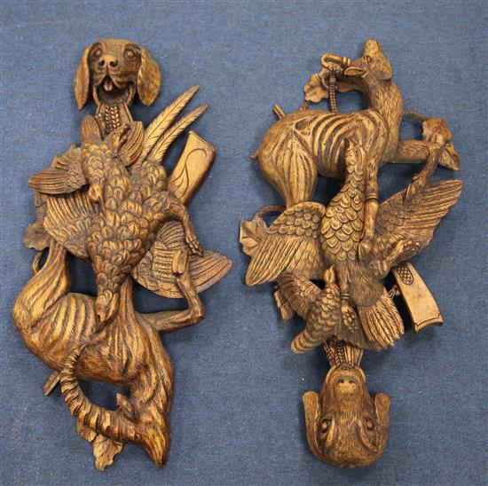 A pair of Black Forest style carved wood wall appliques, 28in.